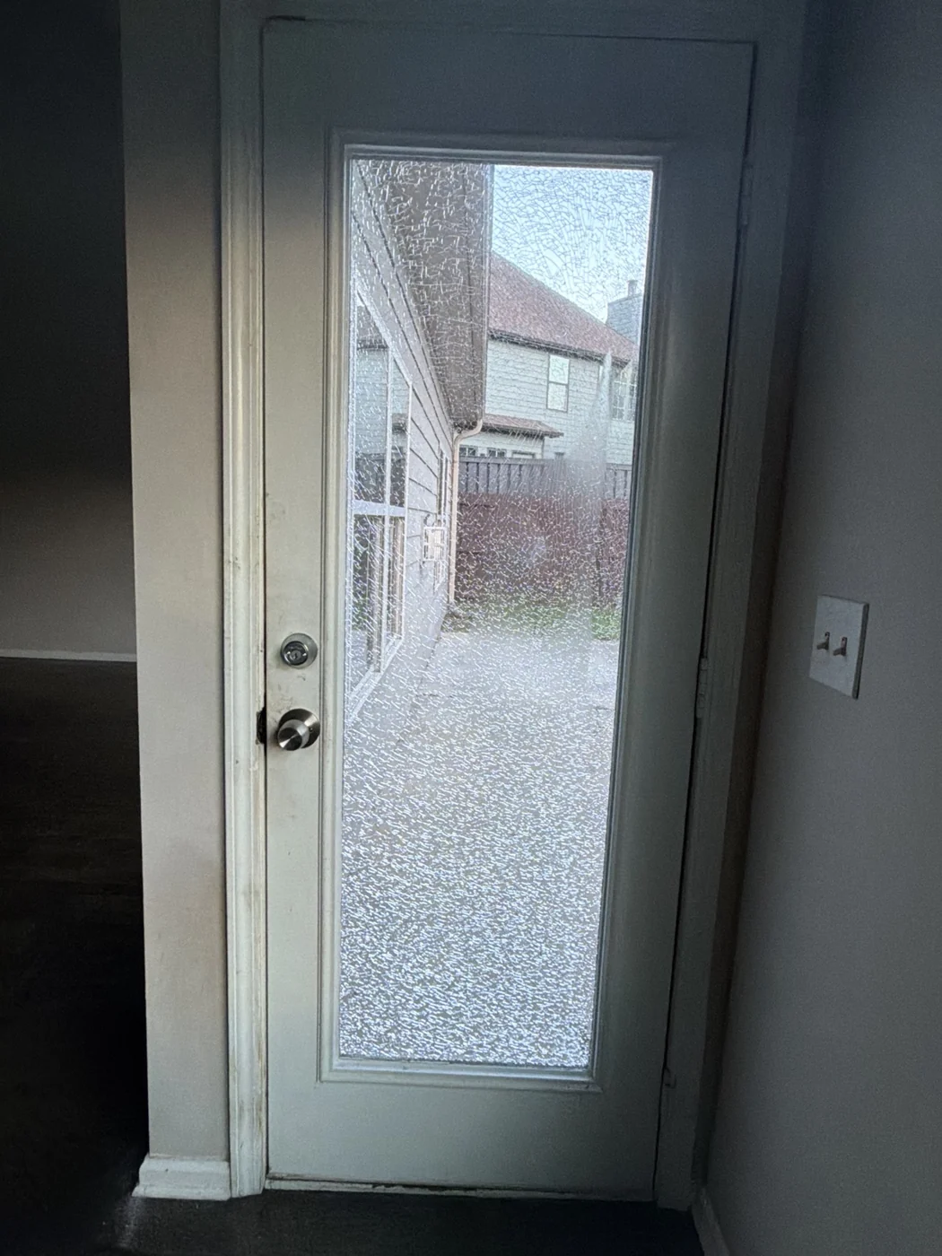 Damaged door glass insert before replacement